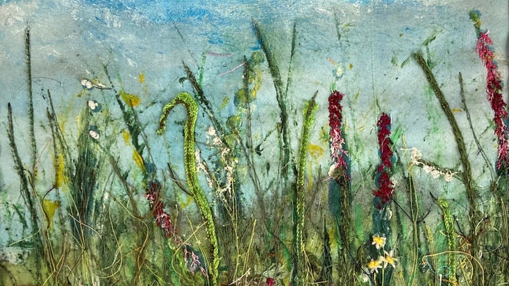 Embroidery detail showing grasses